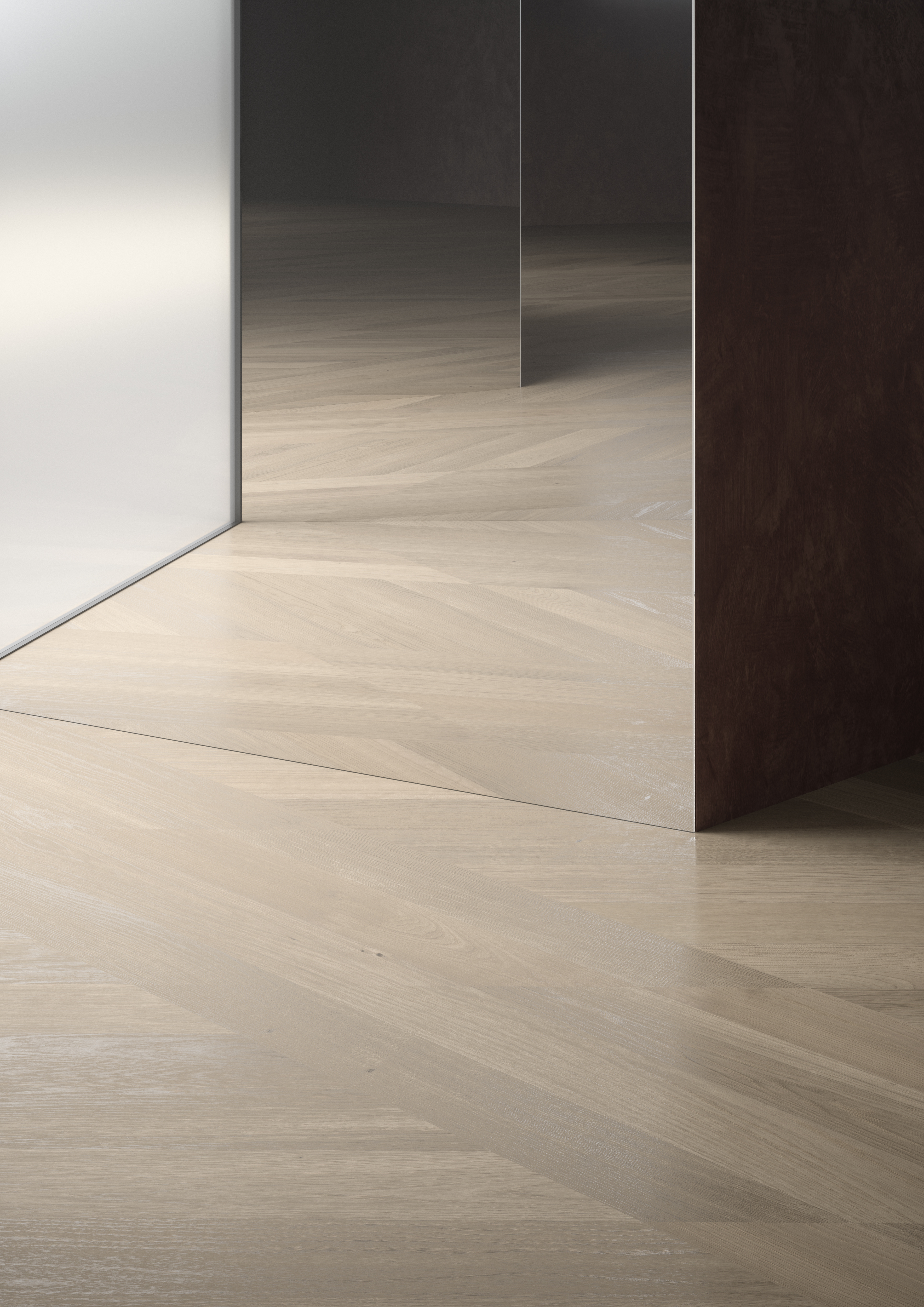Close-up of light parquet flooring with precise, custom-cut joints around a minimalist wall corner.