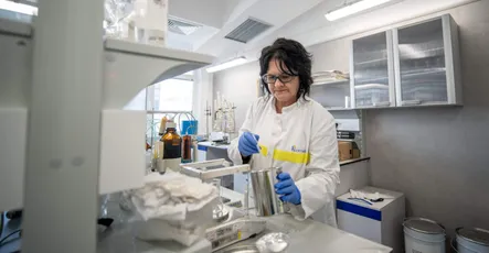 "Laboratory technician in white coat working with Scott Bader resins and composites in a research facility" [G]