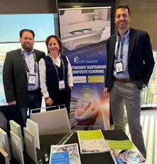 Team at Scott Bader event showcasing lightweight sustainable composite flooring resins for transport applications [G]