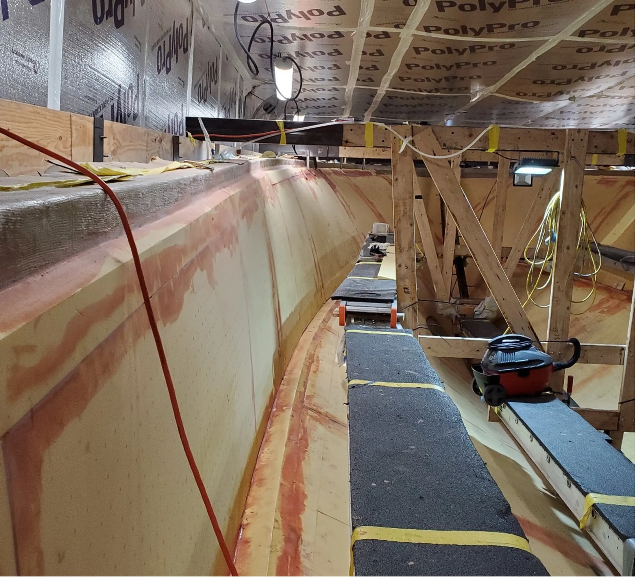 "Boat hull manufacturing with Scott Bader composites and gelcoats for marine applications, showing layup process" [G]