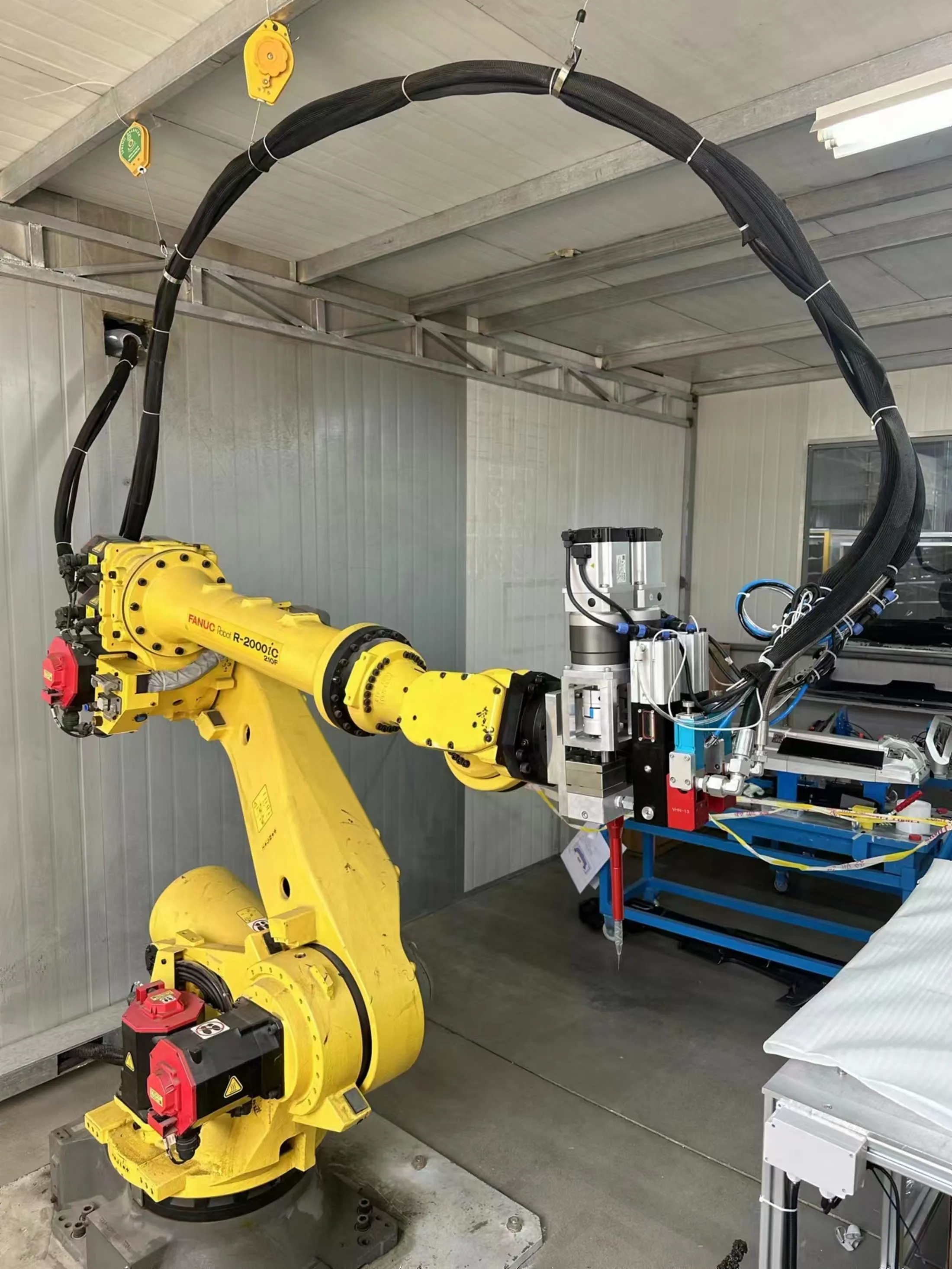 Industrial robotic arm with dispensing equipment for Scott Bader adhesives and resins in manufacturing facility [G]
