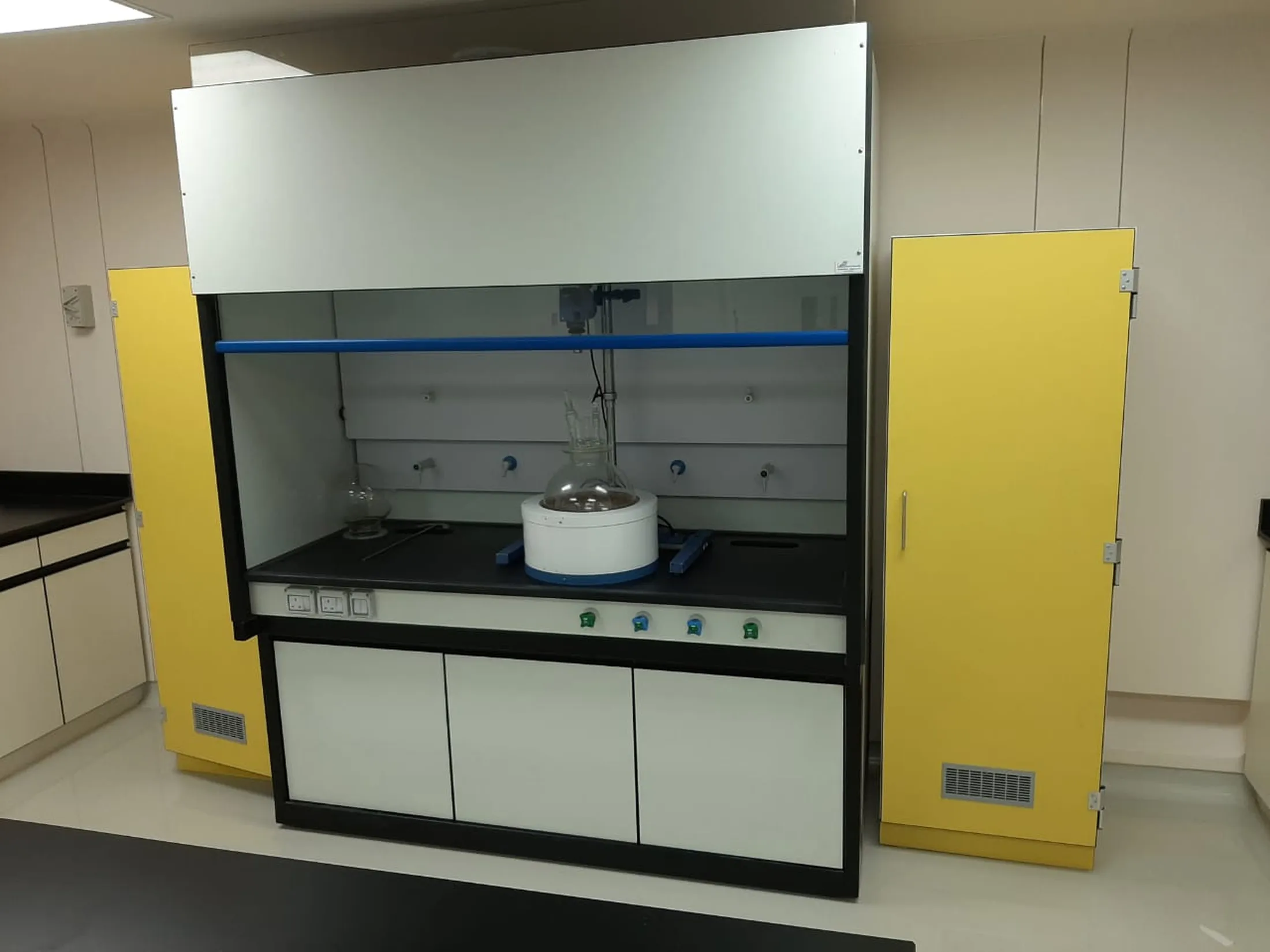 Laboratory fume hood with yellow side panels for handling Scott Bader resins and composites in controlled environments [G]