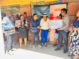 Scott Bader team celebrating a community classroom investment initiative [G]