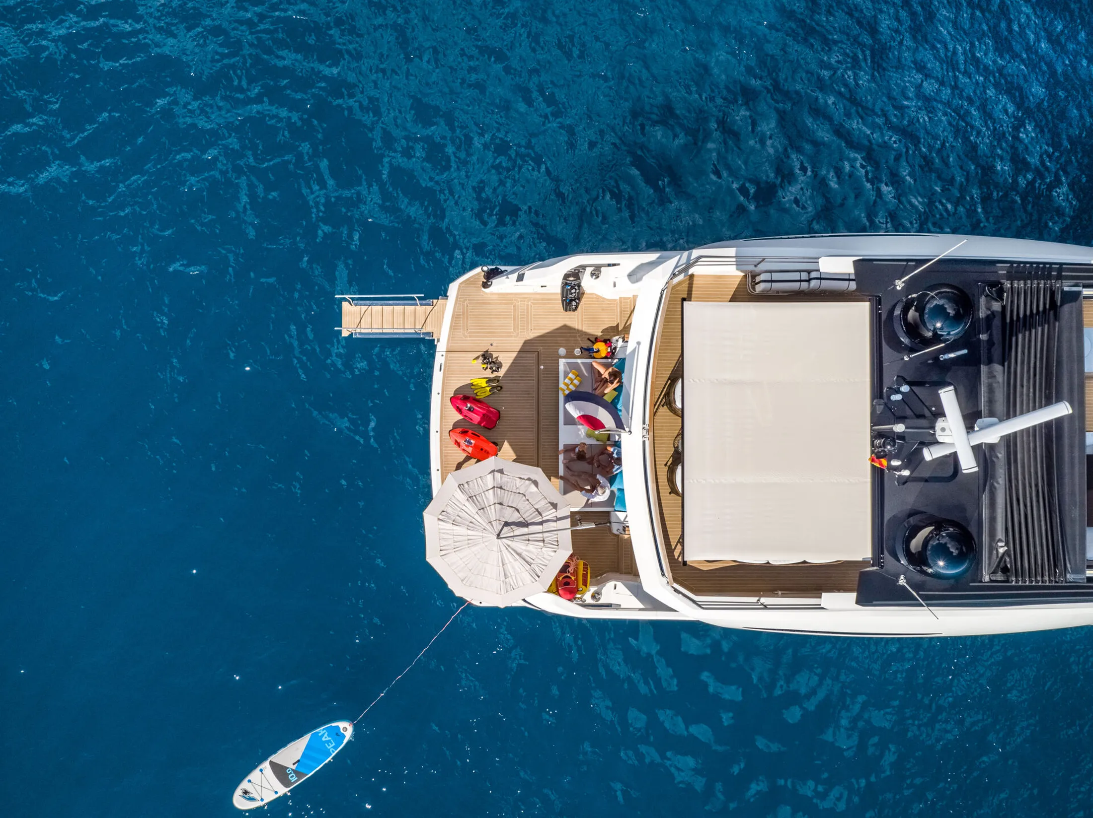 "Aerial view of luxury yacht with Scott Bader gelcoats and composites used in marine applications, sailing in blue waters" [G]