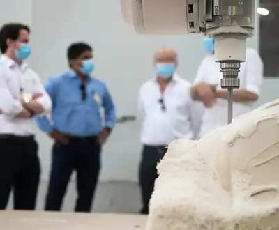 "CNC machine cutting composite material at Scott Bader facility, demonstrating precision manufacturing of advanced resins" [G]