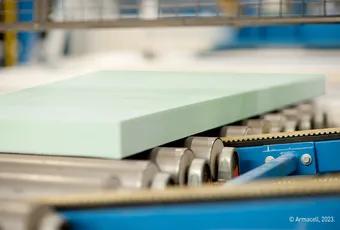 "Light green composite panel on manufacturing conveyor belt - Scott Bader materials for industrial applications" [G]