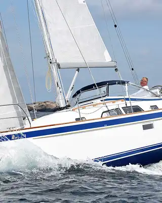 "Sailboat cutting through ocean waves, showcasing Scott Bader gelcoats and composites used in marine applications" [G]