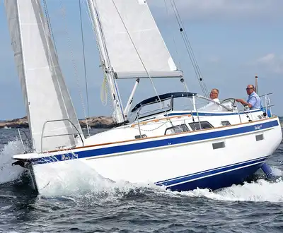 "Sailboat cutting through ocean waves, showcasing Scott Bader gelcoats and composites used in marine applications" [G]