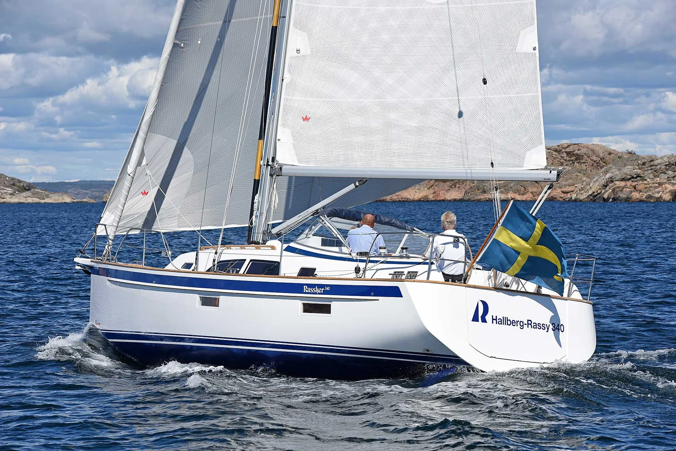 "Sailboat navigating blue waters with white sails - Scott Bader gelcoats and composites used in marine applications" [G]