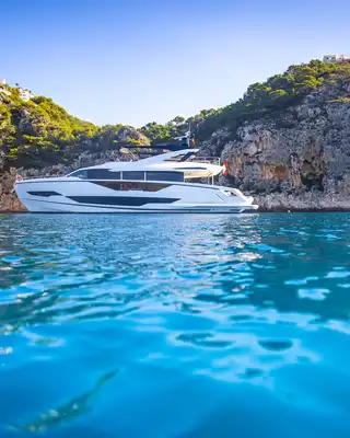 "Luxury yacht cruising along rocky coastline, showcasing Scott Bader gelcoats and composites used in marine applications" [G]