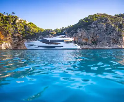 "Luxury yacht cruising along rocky coastline, showcasing Scott Bader gelcoats and composites used in marine applications" [G]