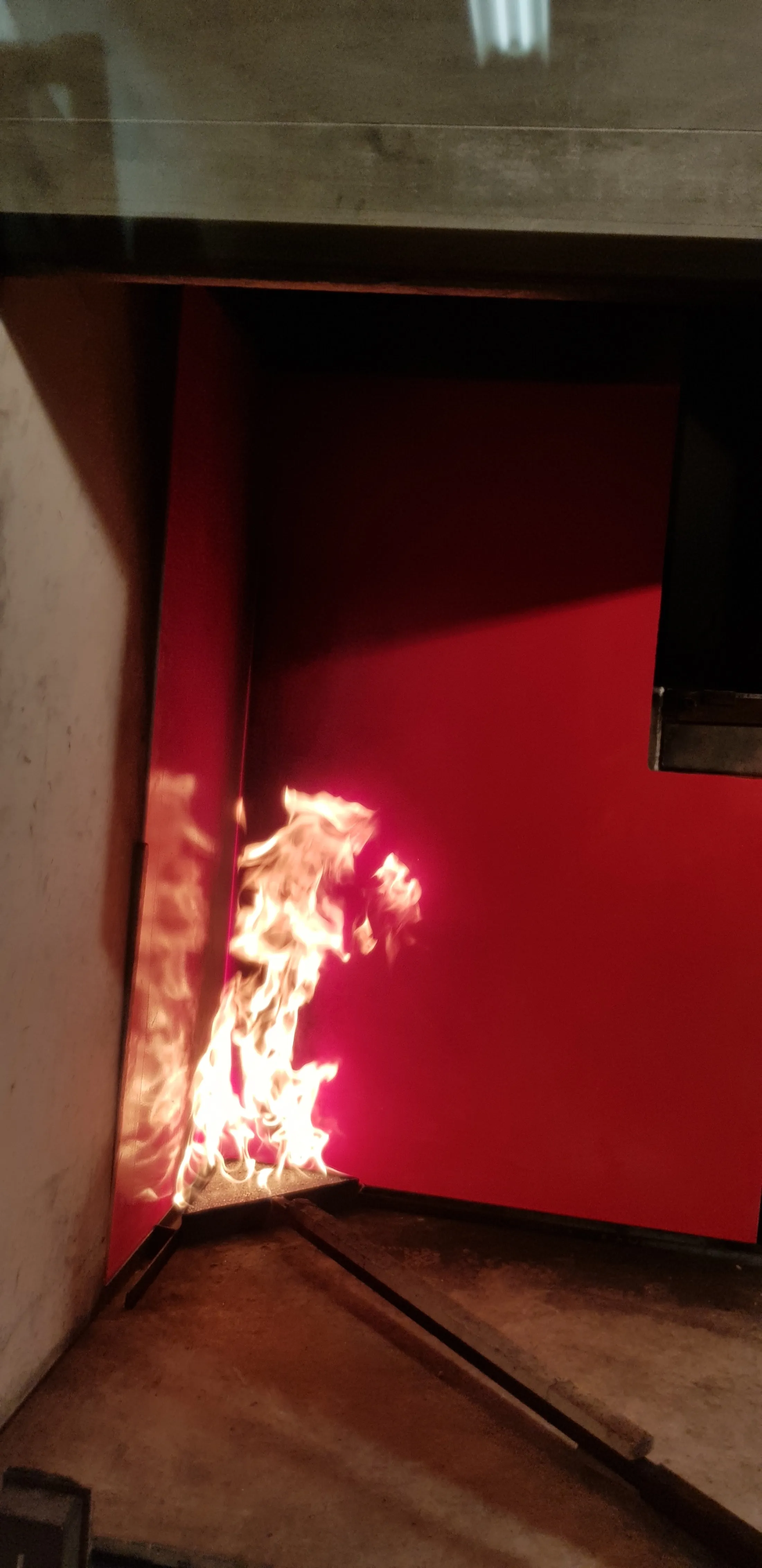 "Fire testing of Scott Bader composites showing flame resistance properties in controlled environment" [G]