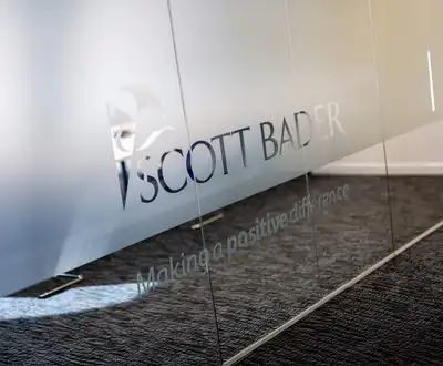 "Scott Bader logo on frosted glass panel with 'Making a positive difference' tagline, showcasing their composites brand identity" [G]