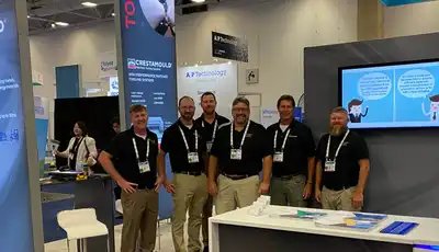 "Scott Bader team at industry exhibition showcasing composites and adhesives solutions at their professional trade show booth" [G]