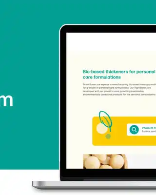 "Laptop displaying Scott Bader's personalcare.com website featuring skincare product information on teal background" [G]