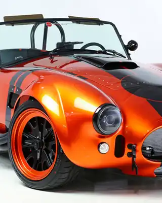 "Sleek orange sports car showcasing Scott Bader composites and gelcoats for high-performance automotive applications" [G]