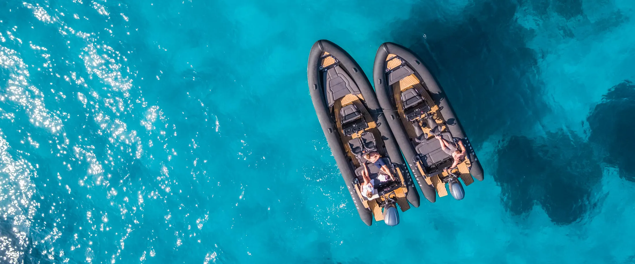 "Aerial view of luxury boats on turquoise water - Scott Bader gelcoats and composites for marine applications" [G]