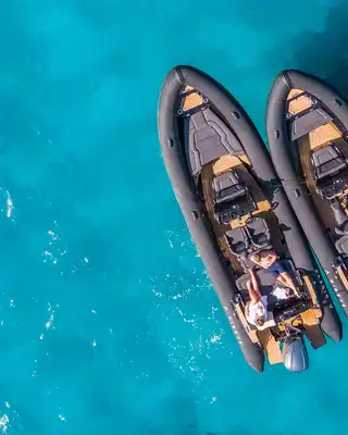 "Aerial view of luxury boats on turquoise water - Scott Bader gelcoats and composites for marine applications" [G]