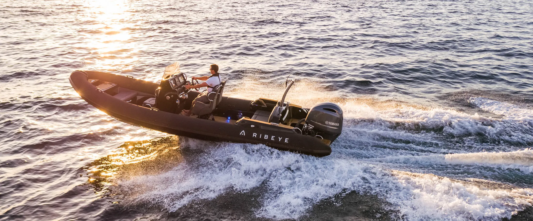 "Speedboat racing across water at sunset, showcasing Scott Bader composites and gelcoats for marine applications" [G]