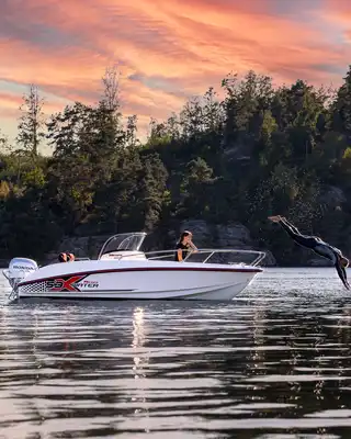 "Sleek motorboat on calm lake at sunset, showcasing Scott Bader gelcoats and composites used in marine applications" [G]