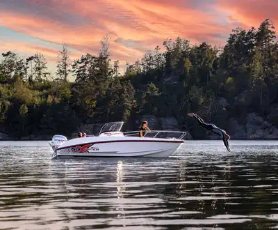 "Sleek motorboat on calm lake at sunset, showcasing Scott Bader gelcoats and composites used in marine applications" [G]