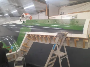 Boat hull mold with green gelcoat applied, showcasing Scott Bader composites and gelcoats in marine manufacturing. [G]