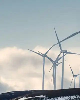 "Wind turbines on snowy hillside - Scott Bader composites and structural adhesives for renewable energy applications" [G]