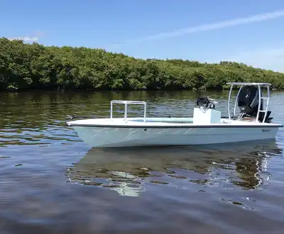 "White motorboat on calm water with mangrove shoreline - Scott Bader composites and gelcoats for marine applications" [G]