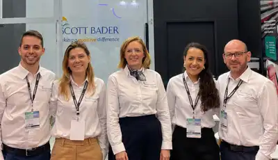 Scott Bader team at trade show booth showcasing composites, gelcoats, and resins expertise. [G]