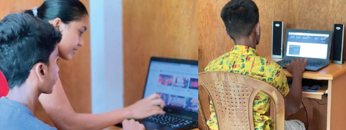 "Students working on computers in an educational setting, supported by Scott Bader's commitment to technology and learning." [G]