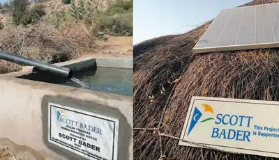 "Scott Bader signage at rural water installation and solar panel on thatched roof, showcasing sustainable applications" [G]
