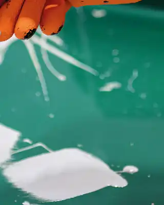 "Application of Scott Bader gelcoats on a green surface, showcasing smooth coating process for composite materials" [G]