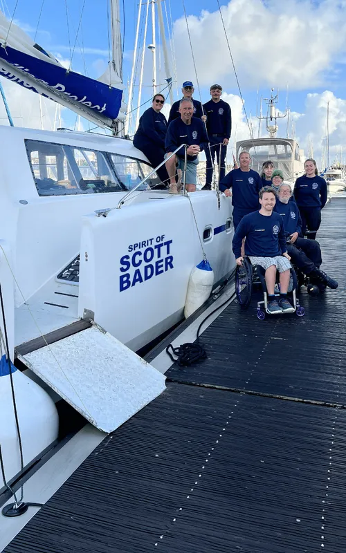 Spirit of Scott Bader sailing catamaran with crew at marina, showcasing Scott Bader composites in marine applications [G]