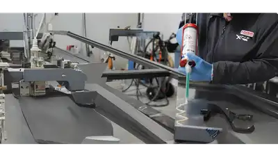 "Technician applying Scott Bader structural adhesives in precision manufacturing process for composite materials assembly" [G]