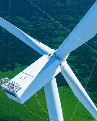 "Aerial view of wind turbine with Scott Bader composites used in renewable energy applications" [G]