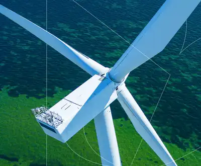 "Aerial view of wind turbine with Scott Bader composites used in renewable energy applications" [G]