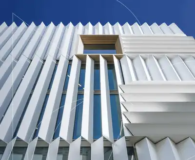 "Modern architectural facade with white composite panels by Scott Bader, showcasing structural materials for building applications" [G]