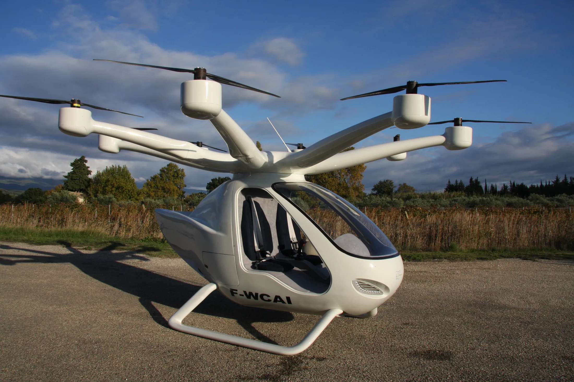 "Modern electric air taxi with multiple rotors showcasing Scott Bader composites for lightweight aerospace applications" [G]