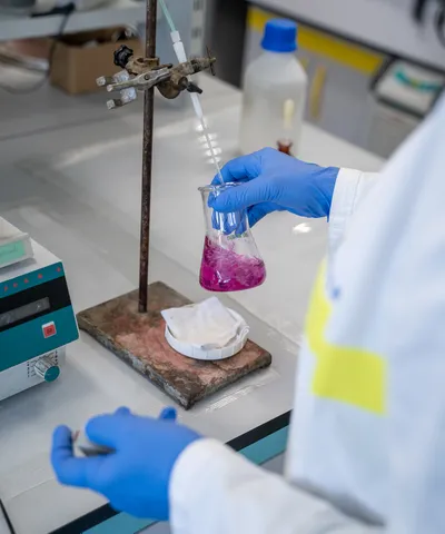 "Laboratory testing of Scott Bader resins in a flask with pink solution for composite materials development" [G]