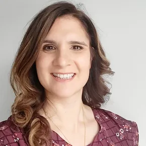 "Professional portrait of a smiling team member against a neutral background" [G]
