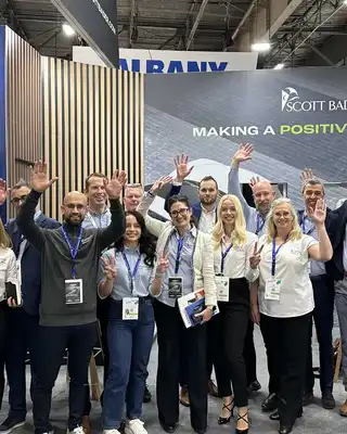 "Scott Bader team at industry exhibition showcasing composites and resins for e-mobility applications" [G]