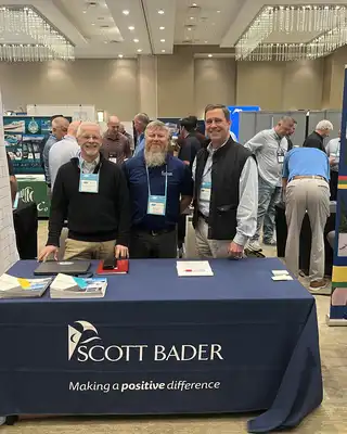 "Scott Bader representatives at industry exhibition showcasing composites and resins for marine applications" [G]