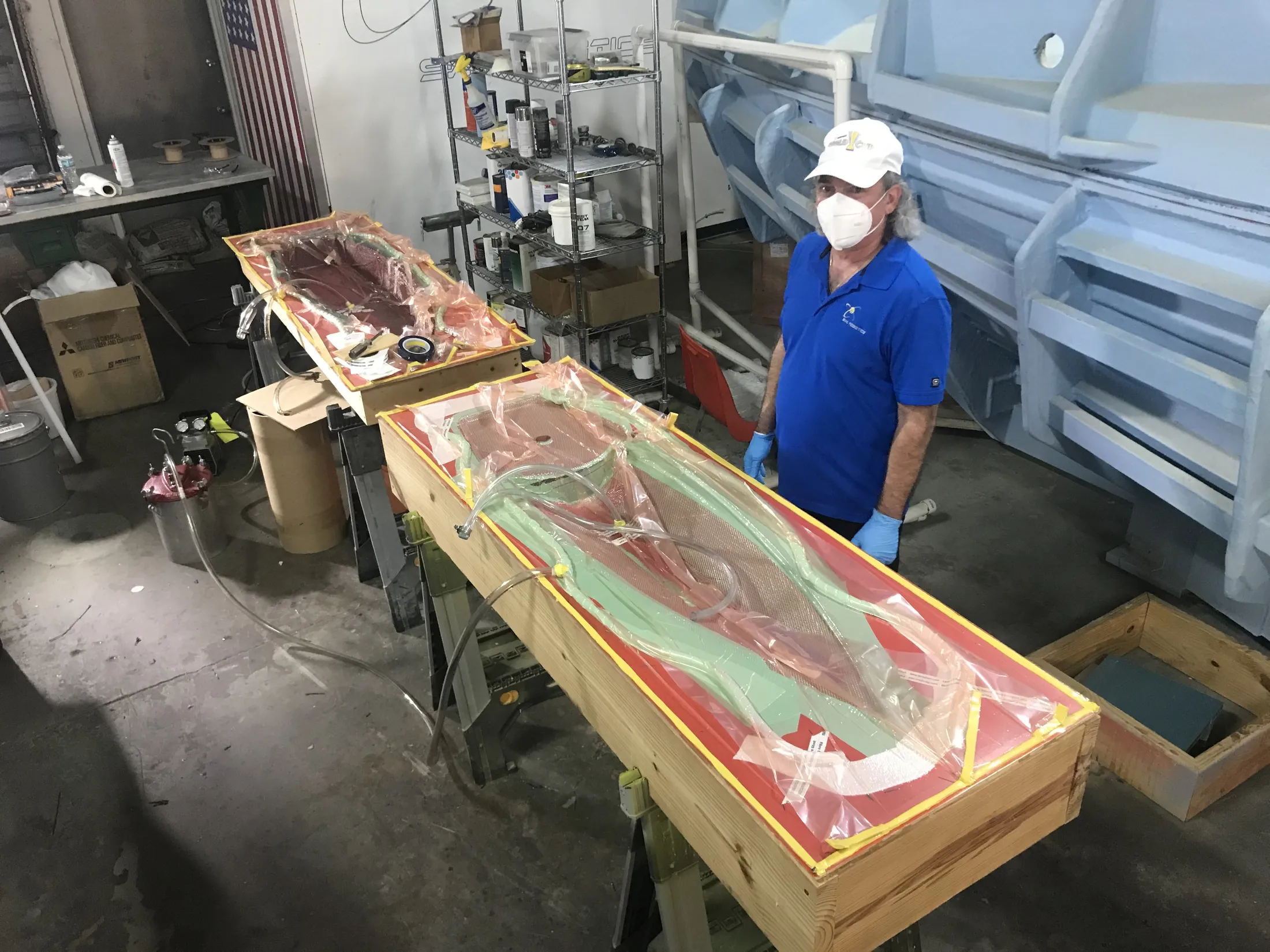"Workshop technician applying Scott Bader resins and gelcoats in composite manufacturing process for custom molds" [G]