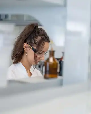 "Laboratory technician at Scott Bader testing resins and composites in a modern research facility" [G]