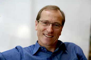 Smiling man in blue shirt, professional headshot, Scott Bader team member portrait. [G]