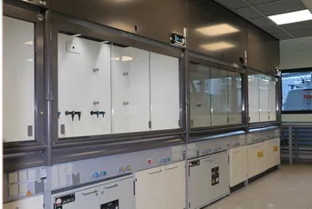 "Modern laboratory fume hood system with glass enclosures for Scott Bader resins and composites testing and development" [G]