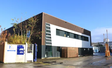 "Modern industrial facility with contemporary architecture, featuring Scott Bader composites and structural adhesives in construction" [G]