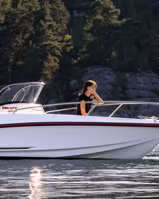 "Motorboat on water with Scott Bader gelcoats and composites used in marine applications, showcasing durability in outdoor recreation" [G]
