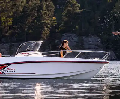 "Motorboat on water with Scott Bader gelcoats and composites used in marine applications, showcasing durability in outdoor recreation" [G]
