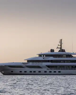 "Luxury yacht on water with Dubai's Burj Al Arab in background, showcasing Scott Bader composites and gelcoats for marine applications" [G]